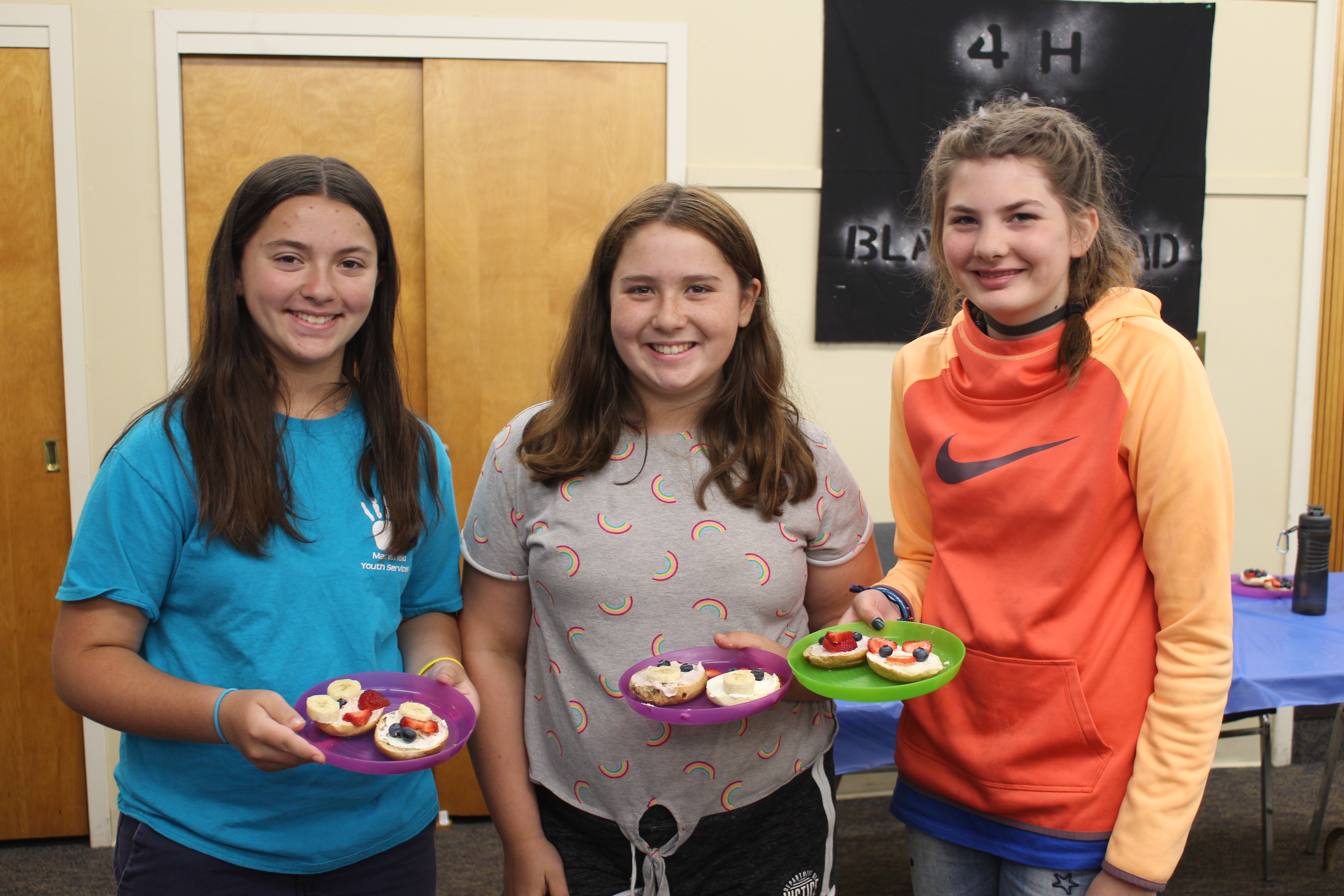 Girls pose with their food